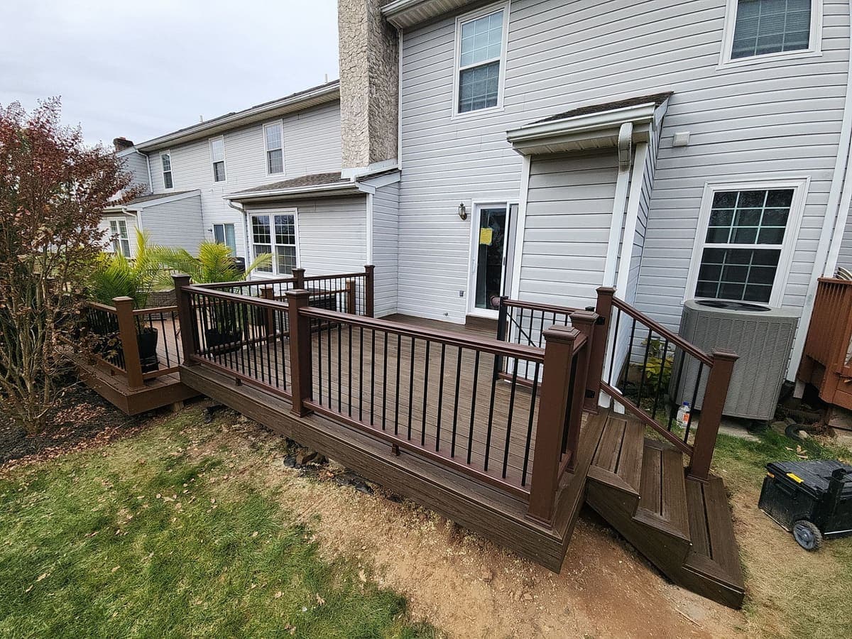 Finished composite deck with brown railings