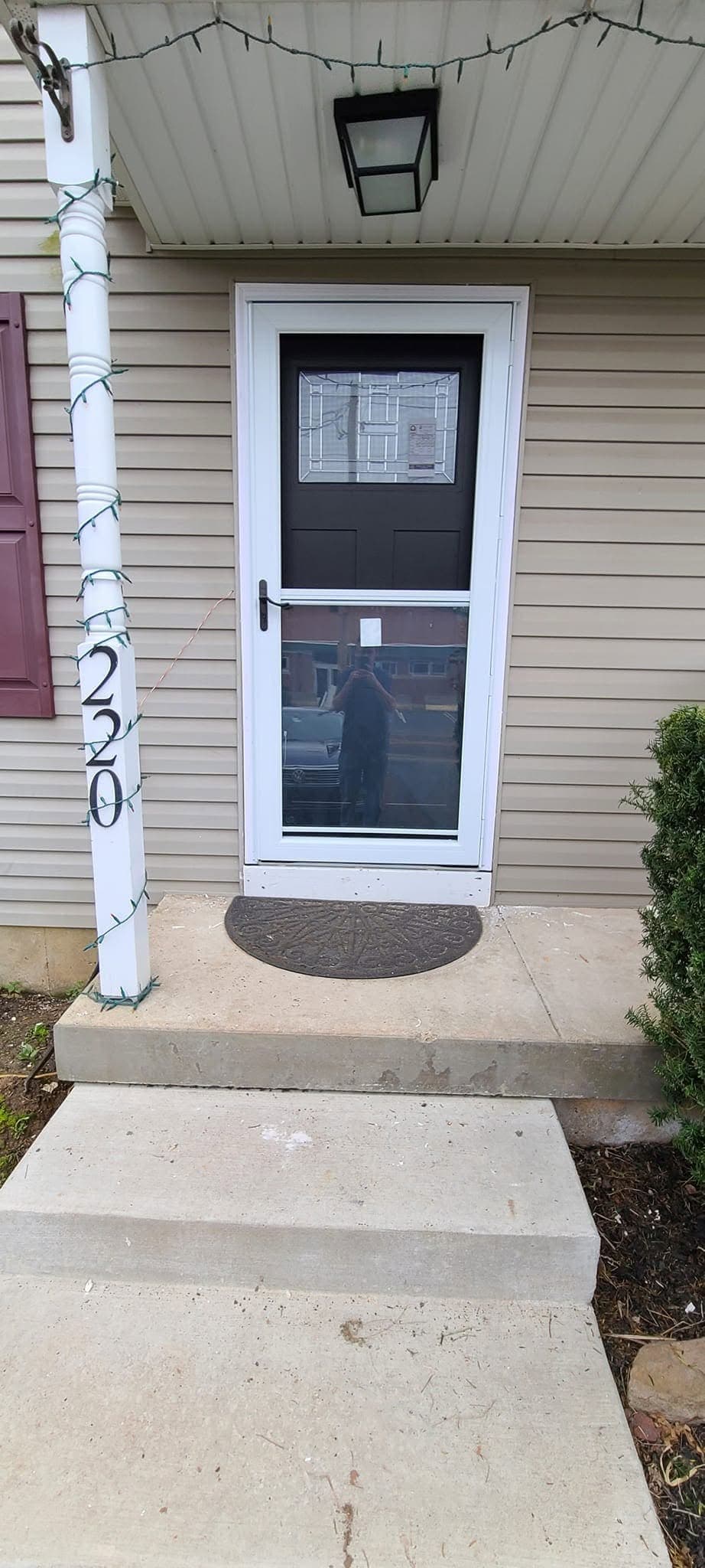 New front entry door with storm door